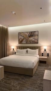 Postel nebo postele na pokoji v ubytování الإقامة الذهبية للشقق المخدومة Golden Residence Hotel