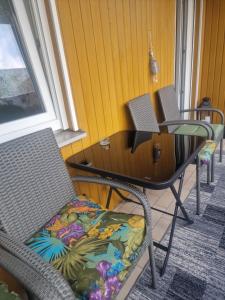 a room with two chairs and a table and a window at Schatzberg in Überlingen