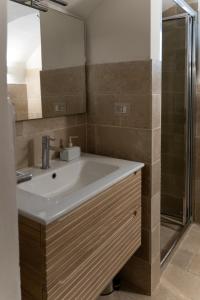 a bathroom with a sink and a shower at Casa Dogana in Gallipoli