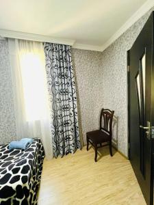 Postel nebo postele na pokoji v ubytování Butichi Guest House