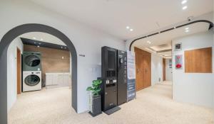 a laundry room with a washing machine and a washer and dryer at Stay Jakjeon in Incheon