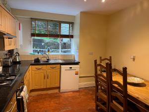 a kitchen with a sink and a counter top at Garden View in Great Malvern