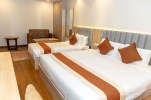Ένα ή περισσότερα κρεβάτια σε δωμάτιο στο Hotel Badrinath