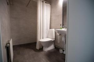 Koupelna v ubytování Lycksele Inn + 37 fotografií