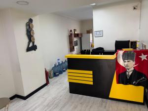an office with a bar with a picture of a man at Pin Suite in Buyukcekmece