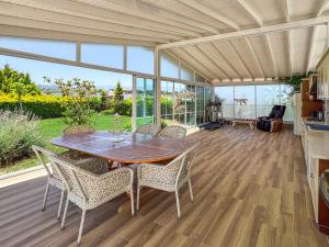a dining room with a table and some chairs at Villa Limon in Kuşadası