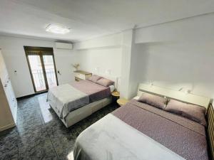 Łóżko lub łóżka w pokoju w obiekcie Playa Bonita Apartment