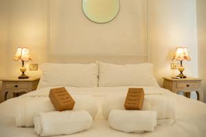 Ένα ή περισσότερα κρεβάτια σε δωμάτιο στο "Casa Tramonto" - Historic Center of Ostuni