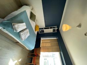 Ένα ή περισσότερα κρεβάτια σε δωμάτιο στο Hotel HEB