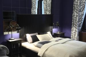 Posteľ alebo postele v izbe v ubytovaní Ambassador Apartment