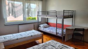 Postel nebo postele na pokoji v ubytování Pokoje Ekonomiczne