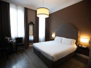 Posteľ alebo postele v izbe v ubytovaní JB Relais- Campo de' Fiori