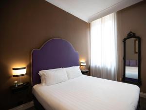 Posteľ alebo postele v izbe v ubytovaní JB Relais- Campo de' Fiori
