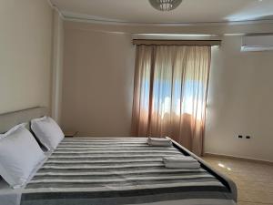 Giường trong phòng chung tại OniRana Apartments