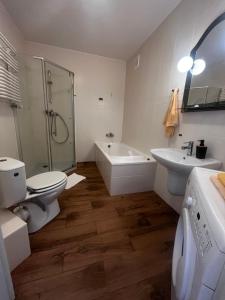 Kúpeľňa v ubytovaní Apartamenty Centrum
