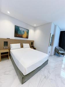 Posteľ alebo postele v izbe v ubytovaní Twin Hotel Tanger