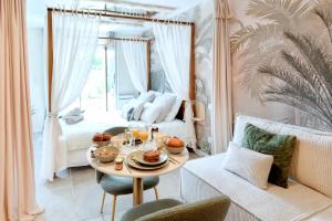 Khu vực ghế ngồi tại Jardin d'Eden : Sauna, Balneo & Jardin privatif