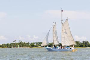 a group of people on a sail boat in the water at Suite C Beach, Firepit, Dog-friendly, Downtown! in Biloxi