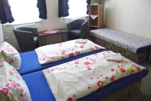 Кровать или кровати в номере Penzión Slávia