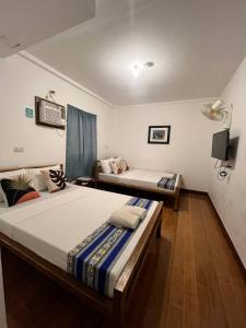 Postel nebo postele na pokoji v ubytování Casa Montemar Heights