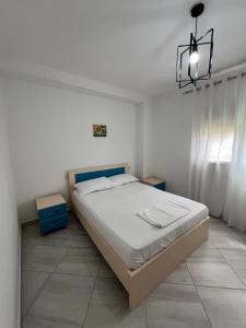Postel nebo postele na pokoji v ubytování Guest House Vlore