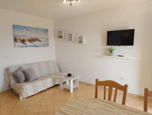 a living room with a couch and a table at Apartments Gojevic in Bol