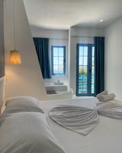 Postel nebo postele na pokoji v ubytování Cava Boutique Hotel