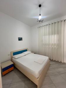 Postel nebo postele na pokoji v ubytování Guest House Vlore