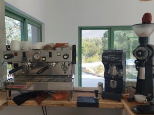 a coffee machine sitting on a counter in a kitchen at Spot Local in Moncarapacho