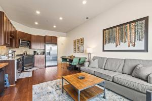 a living room with a couch and a table at The Nook at Newpark-Mountain days Hot tub nights in Park City