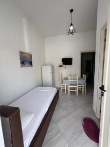 Postel nebo postele na pokoji v ubytování Guest House Vlore