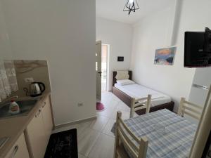 Postel nebo postele na pokoji v ubytování Guest House Vlore