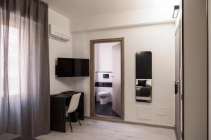 TV a/nebo společenská místnost v ubytování Affittacamere Poerio + 16 fotografií