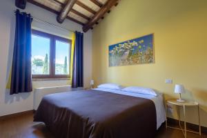 Ένα ή περισσότερα κρεβάτια σε δωμάτιο στο Relais Piano Valle