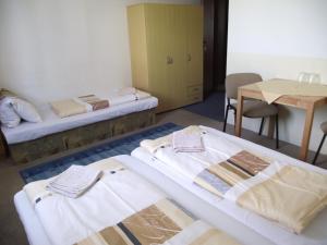 Кровать или кровати в номере Penzión Slávia
