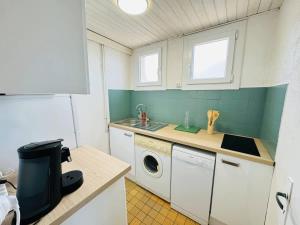 Kuchyň nebo kuchyňský kout v ubytování Valras-Loc - Appartement en Front de Mer avec Balc + 2 fotografie