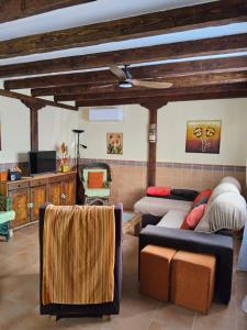 a living room with a couch and a bed at Casa de ensueño in Candeleda