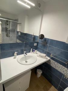 a bathroom with a sink and a mirror at Loft Al Baglio del Gelso in Balestrate +48 photos