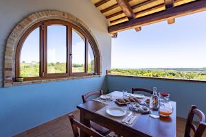 a dining room with a table with food on it at Relais Piano Valle in Pollutri