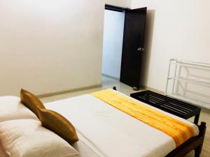 Voodi või voodid majutusasutuse Hotel Happy Vibes toas