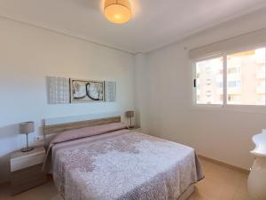 Posteľ alebo postele v izbe v ubytovaní Ayf 3 habitaciones en 1ª linea de playa