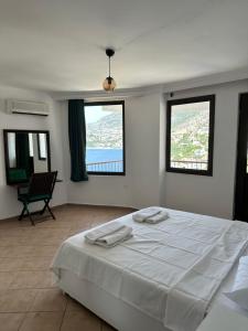 Ένα ή περισσότερα κρεβάτια σε δωμάτιο στο Villa Cemkan