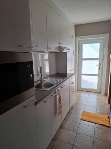 Kuchyň nebo kuchyňský kout v ubytování Appartement à Bredene au rez-de-chaussée