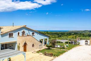 an external view of a house with a view of the ocean at Relais Piano Valle in Pollutri