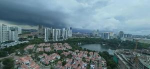 an aerial view of a city with buildings and a river at Sunway Geo Suites AG0E at Sunway City by Ezprop in Subang Jaya