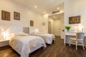 Posteľ alebo postele v izbe v ubytovaní Pellegrini Luxury Rooms