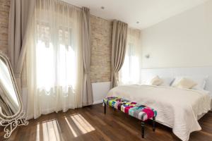 Posteľ alebo postele v izbe v ubytovaní Pellegrini Luxury Rooms