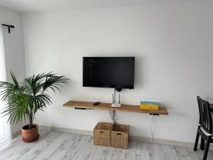 a flat screen tv sitting on top of a wall at Michas House in Puerto del Carmen