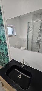 Bilik mandi di Chambres jumelles tout confort