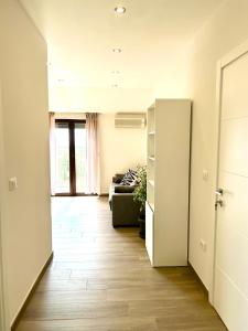 a hallway with a living room with a couch at Apartments Ana in Novigrad Istria